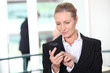 Woman dialing phone number