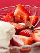 Fresh sliced strawberries in glass dish