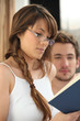 Young woman reading in bed