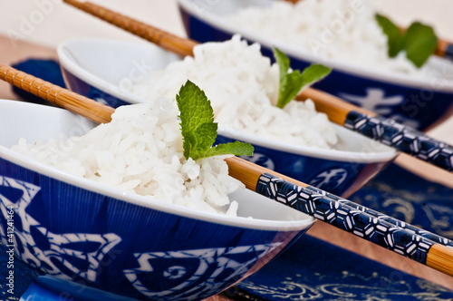 Photo: cups of basmati rice with chopsticks cups of basmati rice with chopsticks