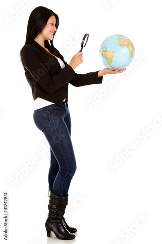 Photo: Woman looking at the globe Woman looking at the globe