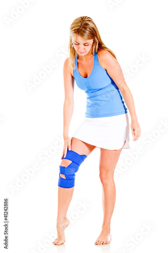 Photo: Woman with a knee injury Woman with a knee injury