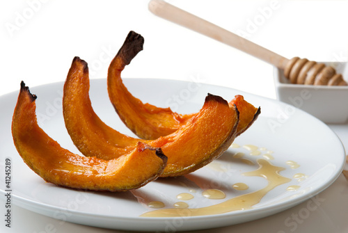 Photo: pumpkin desert on plate isolated on white pumpkin desert on plate isolated on white
