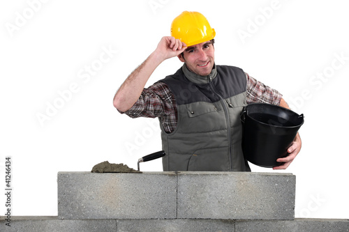 Photo: Man building stone wall Man building stone wall