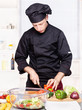 chef cutting bell peppers in kitchen