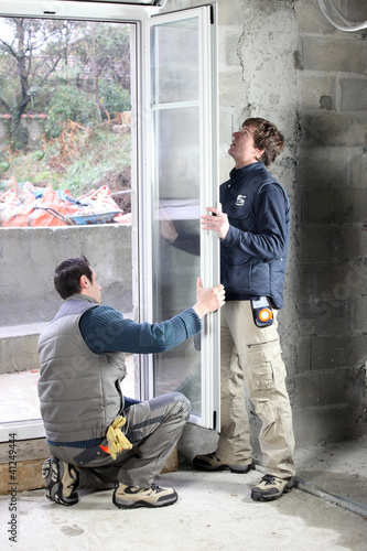 Photo: carpenter and younger apprentice at wok carpenter and younger apprentice at wok