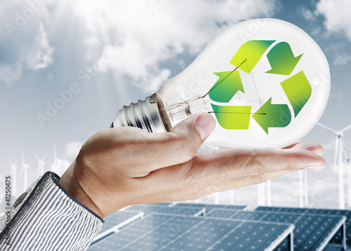 Photo: Green light bulb environment concept Green light bulb environment concept