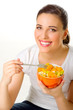 Young woman with fruit salad