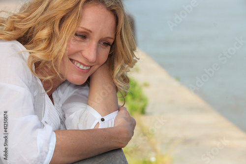 Photo: Smiling woman on a boardwalk Smiling woman on a boardwalk