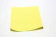 Yellow note with clip on white background