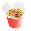 Noodles with pork and vegetables in take-out box on white backgr