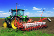 Tractor plowing the fields in early spring.