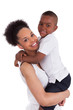 Litte black boy kissing her mother