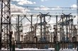 Electric pylons against blue sky