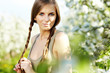Spring woman in summer dress walking in park Spring woman in summer dress walking in park