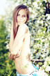 Spring woman in summer dress walking in park Spring woman in summer dress walking in park
