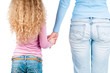 Mother and daughter hand in hand