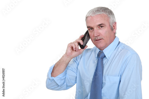 Photo: Man talking on the telephone Man talking on the telephone