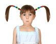 Portrait of funny surprised child girl with long tails on white