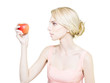 Thin undernourished woman holding an apple