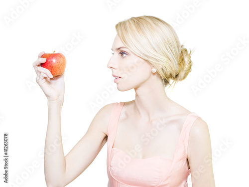 Photo: Thin undernourished woman holding an apple Thin undernourished woman holding an apple