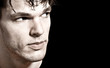 Close-up of young man's face looking sideways