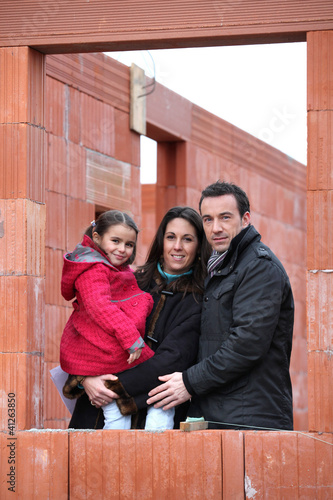 Photo: Family at construction site Family at construction site