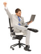 young businessman sitting in chair with laptop young businessman sitting in chair with laptop