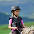 Horse riding - portrait of lovely equestrian on a horse