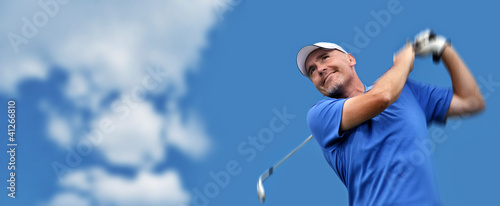 Photo: golfer shooting a golf ball golfer shooting a golf ball