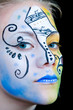 Beautiful girl with colorful face paint