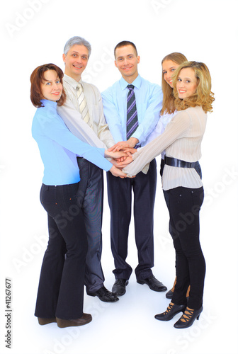 Photo: Smiling business people holding hands together in a Smiling business people holding hands together in a