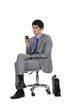 Businessman sat next to briefcase
