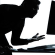 one business man silhouette computing computer angry displeased
