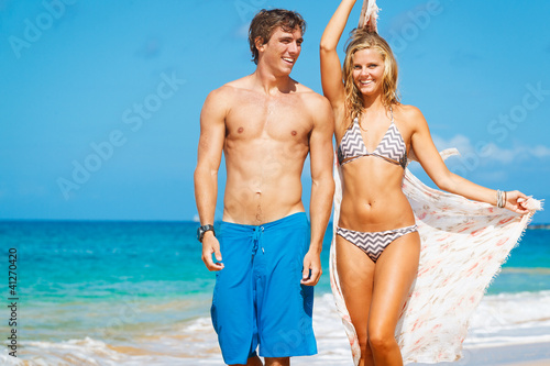 Photo: Attractive Couple on the Beach Attractive Couple on the Beach