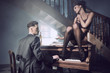 Sexy couple in an intimate situation with piano
