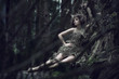 Eco lady lying on the trunk