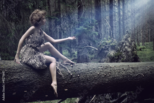Photo: Sexy women sitting on the tree Sexy women sitting on the tree