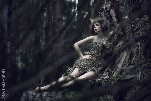 Photo: Eco lady lying on the trunk Eco lady lying on the trunk