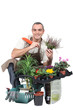 Photo: Smiling gardener on white background Smiling gardener on white background