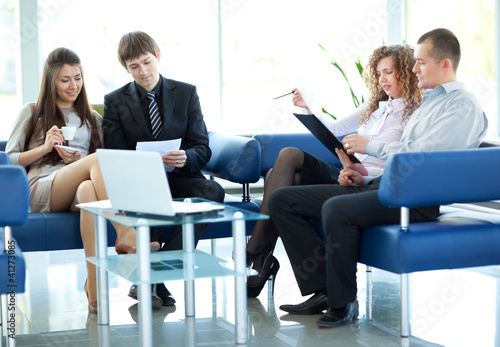 Photo: Business meeting - manager discussing work with his colleagues Business meeting - manager discussing work with his colleagues