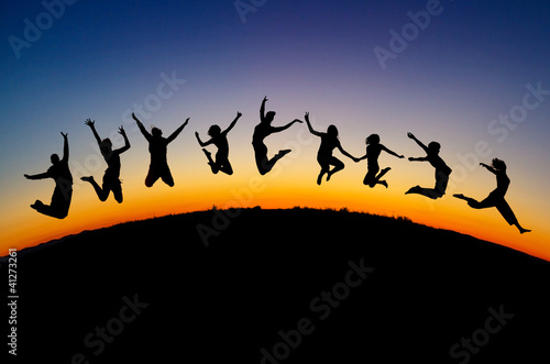 Photo: silhouette of teens jumping on hill silhouette of teens jumping on hill