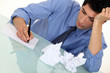 A businessman writing. A businessman writing.