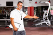 happy male gym trainer welcome customer