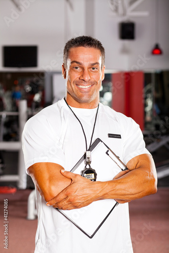 Photo: handsome professional gym instructor portrait handsome professional gym instructor portrait