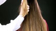 Extreme closeup of long hair beeing cut