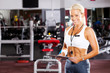happy young female gym personal trainer happy young female gym personal trainer