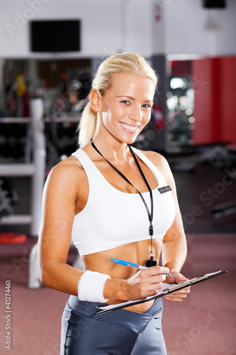 Photo: happy female gym instructor portrait happy female gym instructor portrait