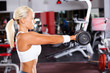 fit woman doing workout with dumbbell
