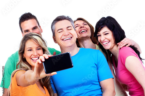 Photo: Group of happy people with a smartphone. Group of happy people with a smartphone.